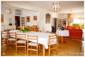 a living room with a table and a couch at B&B Villa Vale Flores in Viana do Castelo