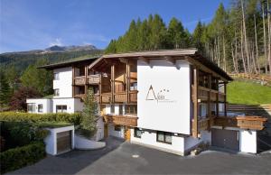 a building with a large sign in front of it at Appartement Alpin in Sölden