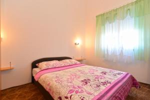 Postel nebo postele na pokoji v ubytování Apartments Bernarda 1773