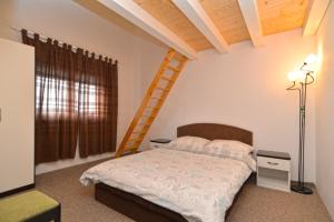 Postel nebo postele na pokoji v ubytování Apartments Bernarda 1773