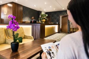 Lobbyen eller receptionen på Best Western Plus Royal Suites