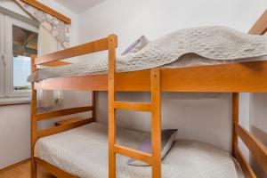 a couple of bunk beds in a small room at Villas Kampor in Kampor