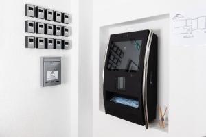 an arcade machine is attached to a wall at Apartments Laatzen | contactless check-in in Hannover