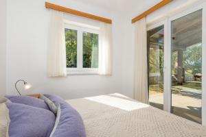 Posteľ alebo postele v izbe v ubytovaní Villas Kampor