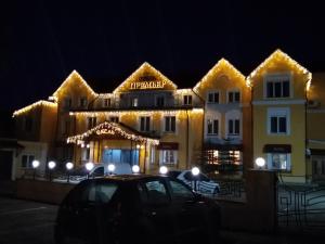 a building with lights on it at night at Premier Hotel in Kostroma