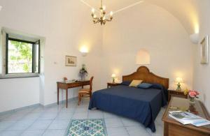 Postel nebo postele na pokoji v ubytování Il Ducato Di Ravello