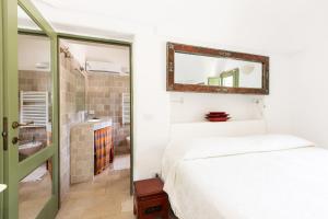 Trulli Masseria Donno Santo客房内的一张或多张床位