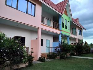 a house painted in different colors at Peace Pool Resort in Khun Han