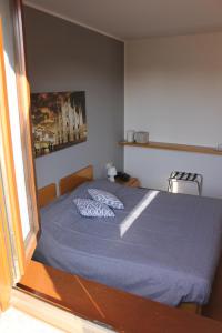 Un pat sau paturi într-o cameră la ALBERGO LA SCALETTA