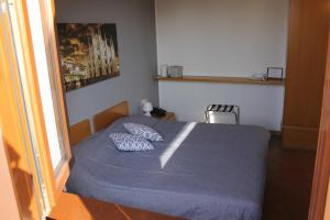Un pat sau paturi într-o cameră la ALBERGO LA SCALETTA