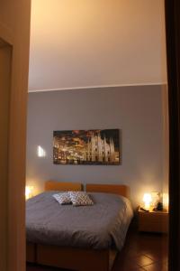 Un pat sau paturi într-o cameră la ALBERGO LA SCALETTA