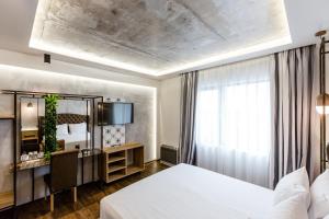 Säng eller sängar i ett rum på HOTEL FINIX CASINO