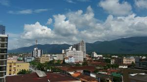 a view of a city with buildings and mountains at Vila Caiçara Nice Location - Linda Vista ! in Solemar