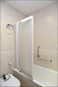 a bathroom with a shower and a toilet in it at Apartament IMA in Lloret de Mar +16 photos