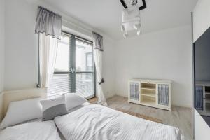 מיטה או מיטות בחדר ב-Apartamenty Sun & Snow Międzyzdrojski Rynek
