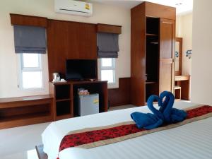 Postel nebo postele na pokoji v ubytování Tamarind Lanta Resort