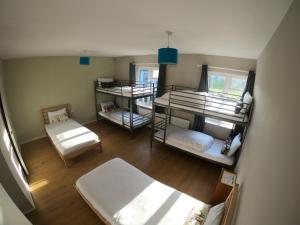 Postel nebo postele na pokoji v ubytování Rougey Lodge Hostel