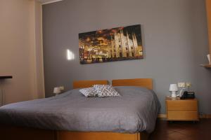 Un pat sau paturi într-o cameră la ALBERGO LA SCALETTA