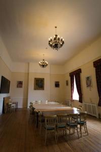 a dining room with a large table and chairs at The Angel Hotel in Helston
