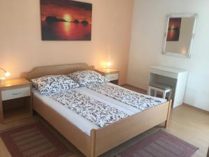Кровать или кровати в номере Apartments Villa Ivva