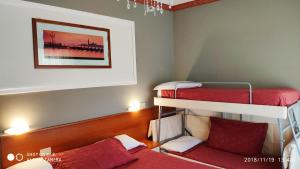 Кровать или кровати в номере Hotel Minerva