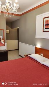 Кровать или кровати в номере Hotel Minerva