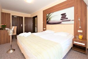 Postel nebo postele na pokoji v ubytování Puchacz - Spa