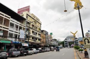 a city street filled with lots of traffic at Topnorth Hotel Maesai in Mae Sai