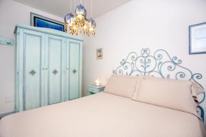 En eller flere senge i et værelse på Appartamento Mare Sardegna Murta Maria - Olbia