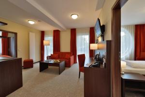 TV a/nebo společenská místnost v ubytování Aribo Hotel