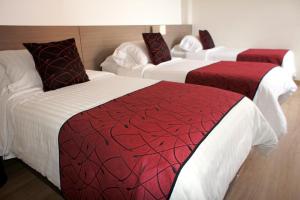 Postel nebo postele na pokoji v ubytování SM Grand Hotel
