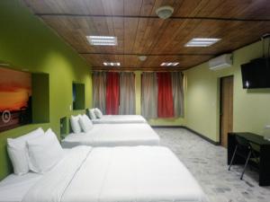Кровать или кровати в номере Kartagus Hotel
