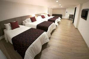 Postel nebo postele na pokoji v ubytování SM Grand Hotel