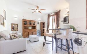 a living room with a couch and a table at Bilocale Giulia in Casa Alzi +3 photos