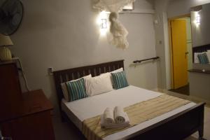 Postel nebo postele na pokoji v ubytování Grand Resort