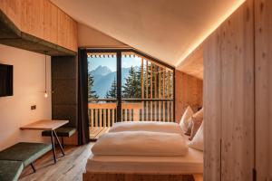 Postel nebo postele na pokoji v ubytování Oberhauser Hütte Rodenecker - Lüsner Alm