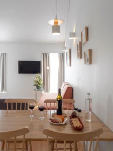 a table that has a plate of food on it at Lisbon Serviced Apartments - Benformoso in Lisbon