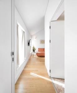 a room with a white wall and a blue floor at Lisbon Serviced Apartments - Benformoso in Lisbon