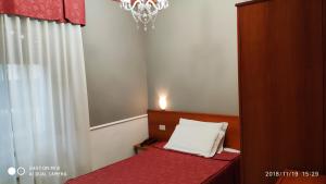 Кровать или кровати в номере Hotel Minerva
