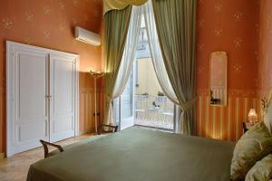 A bed or beds in a room at La Casa Sul Nilo