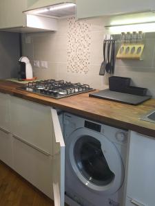 A kitchen or kitchenette at New Capolinea 5 - Apartment
