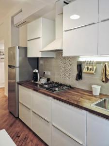 A kitchen or kitchenette at New Capolinea 5 - Apartment