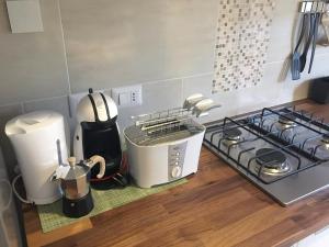 A kitchen or kitchenette at New Capolinea 5 - Apartment