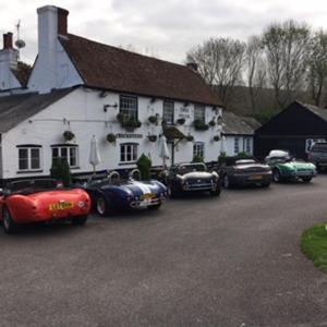 a group of cars parked in front of a building at The Cricketers Arms in Petworth