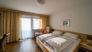 Posteľ alebo postele v izbe v ubytovaní Pension und Appartement Weinschreiber