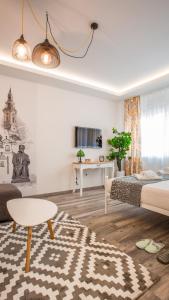 a living room with a bed and a table at Casablanca apartment in Belgrade
