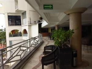 Un balcón o terraza en SUITE SELECT TORRES GEMELAS