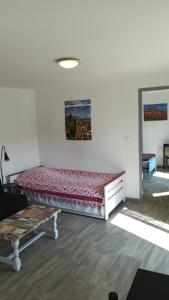 Postel nebo postele na pokoji v ubytování Le Pavillon de l’île au Trésor