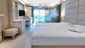 Ένα ή περισσότερα κρεβάτια σε δωμάτιο στο Bull Dorado Beach & SPA +62 φωτογραφίες