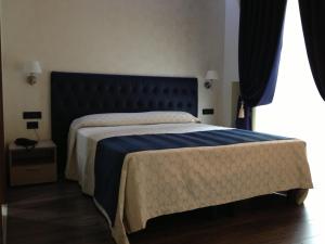 Postel nebo postele na pokoji v ubytování Hotel Continental